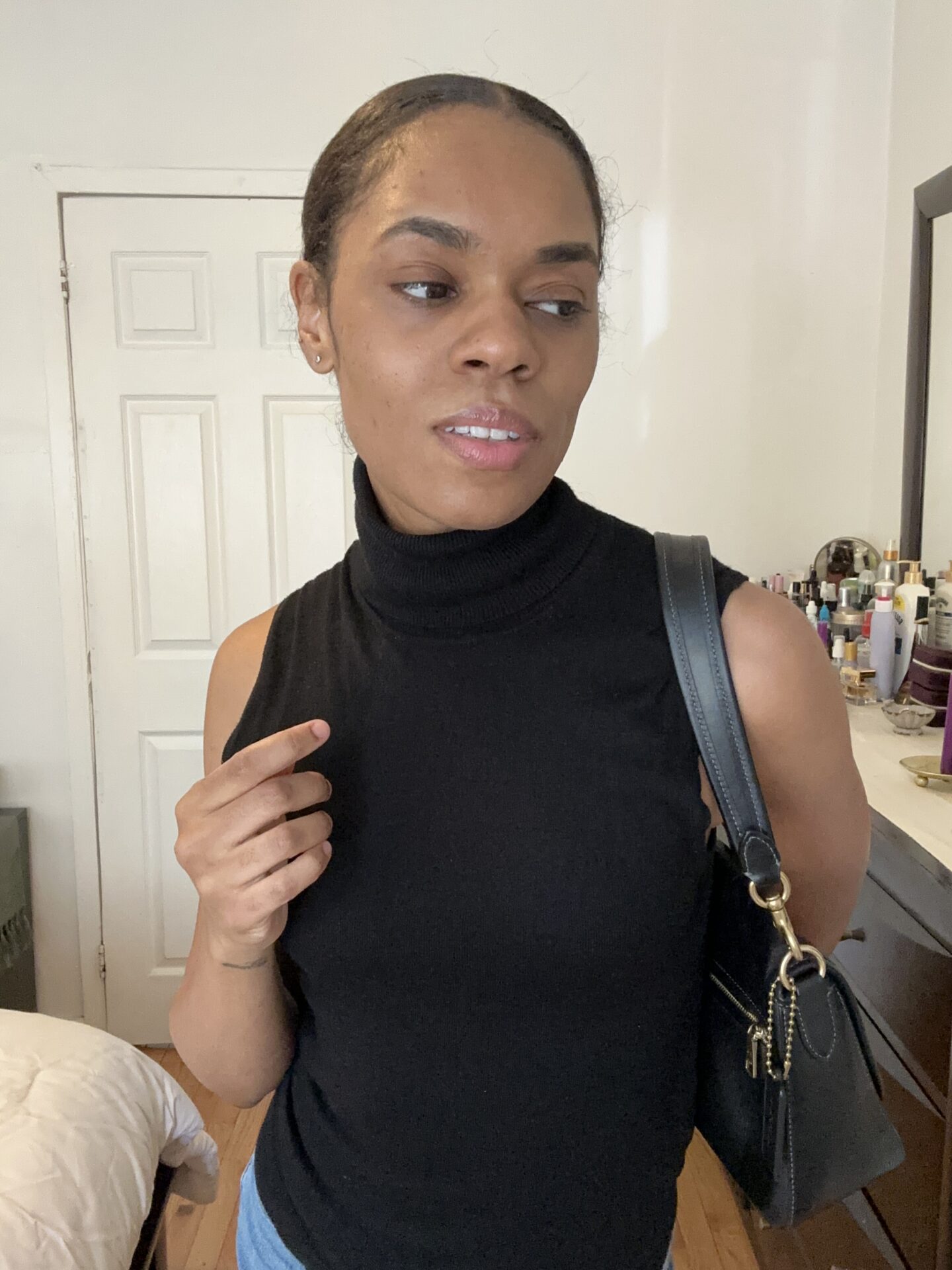 Very Venusian wearing a sleeveless turtleneck knit from Mango 3